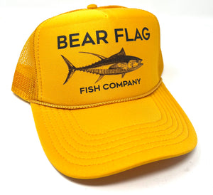 Foam Trucker Tuna Hat Yellow - Bear Flag Fish Co. Our Classic Yellow Bear Flag Fish Co All Black Trucker. With White Accents, This Hat has The Words Bear Flag Fish Company and a Tuna Graphic on it. Perfect for those Beach Days.