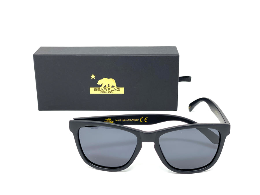 Sunglasses Polarized  (Harpoon) - Bear Flag Fish Co. Black Unisex, Polarized Sunglasses. Relaxed fit and stylish. Gold Harpoon logo on side of sunglasses with a Gold Bear Flag logo on box and carrying case.