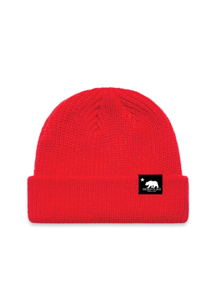 Red Bear Flag Fisherman Beanie - Bear Flag Fish Co. Wide, Ribbed Knit, Fitted Fisherman Style Beanie. Cuffed hem, mid weight.   100% Acrylic   One size fits all . Red Beanie with black tag that displays bear flag logo in white. 